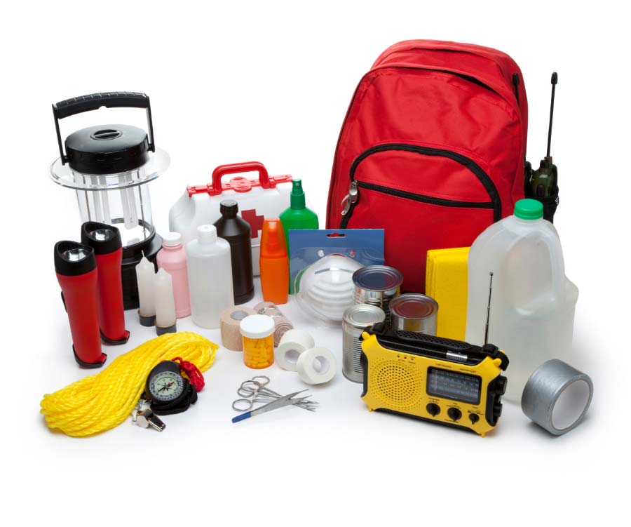 various emergency supplies such as flashlights, rope, compass, medical supplies, radio, food, water, tape and backpack